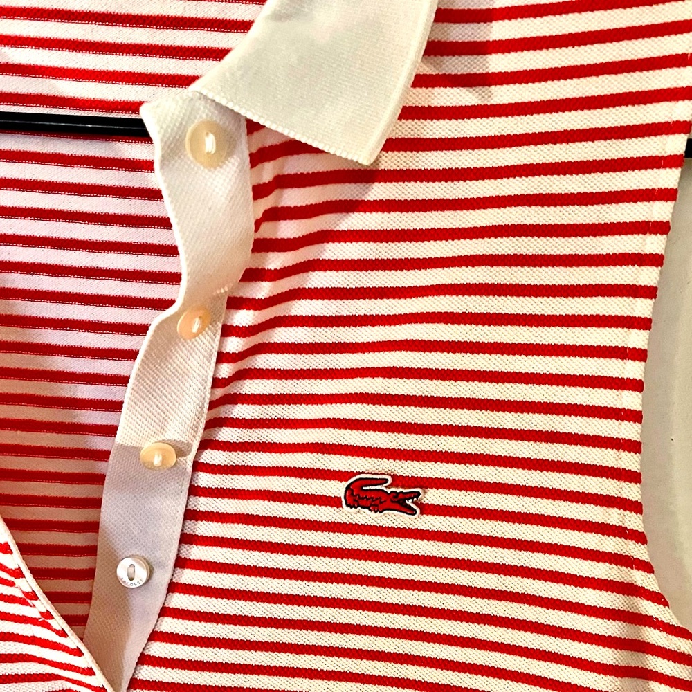 Red and white Lacoste sleeveless top. Fits perfectly.